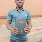 Distributing bibles. Uganda Missions 2024